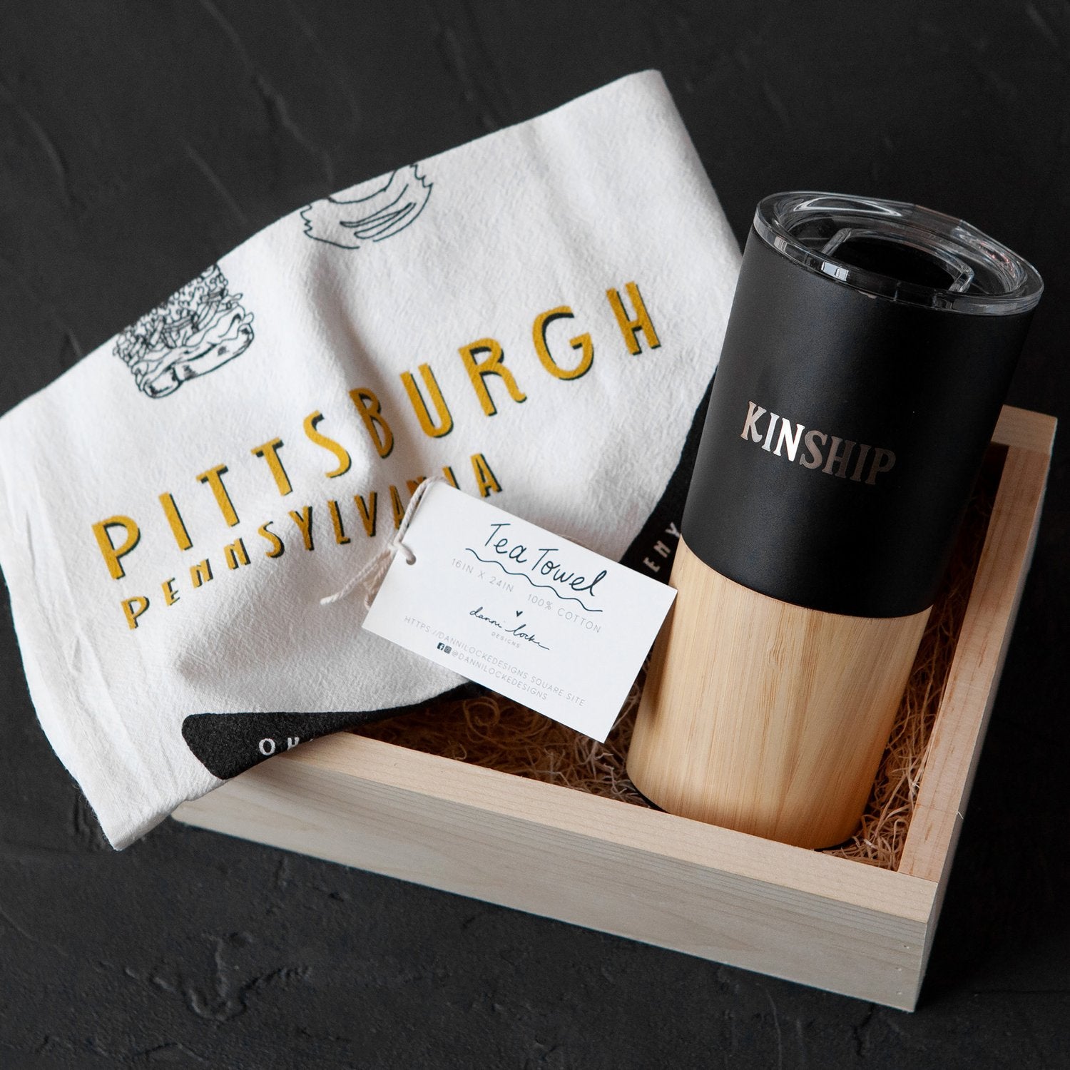 Wooden gift box with a local Pittsburgh-themed tea towel and a logo customized Welly drinkware