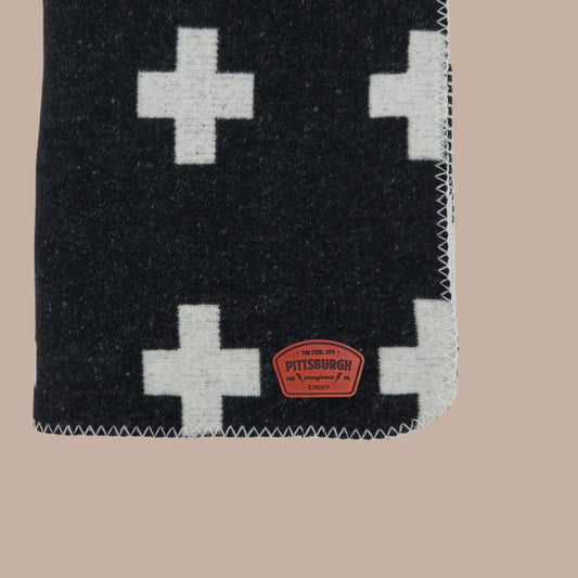 Cozy Plus Sign Reversible Throw with Leather Patch